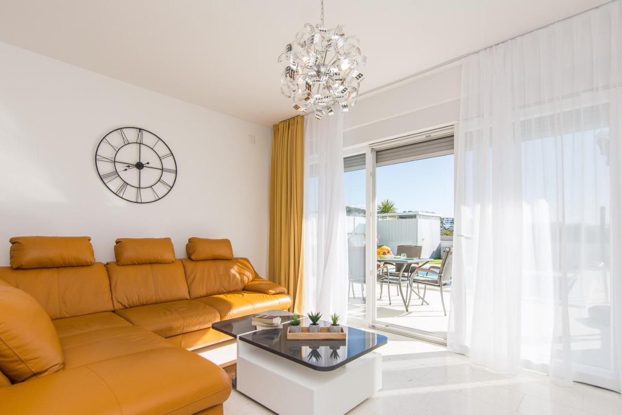 Living room opening onto the pool terrace