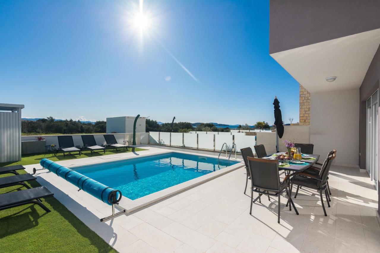 Roof terrace above the pool in full sun